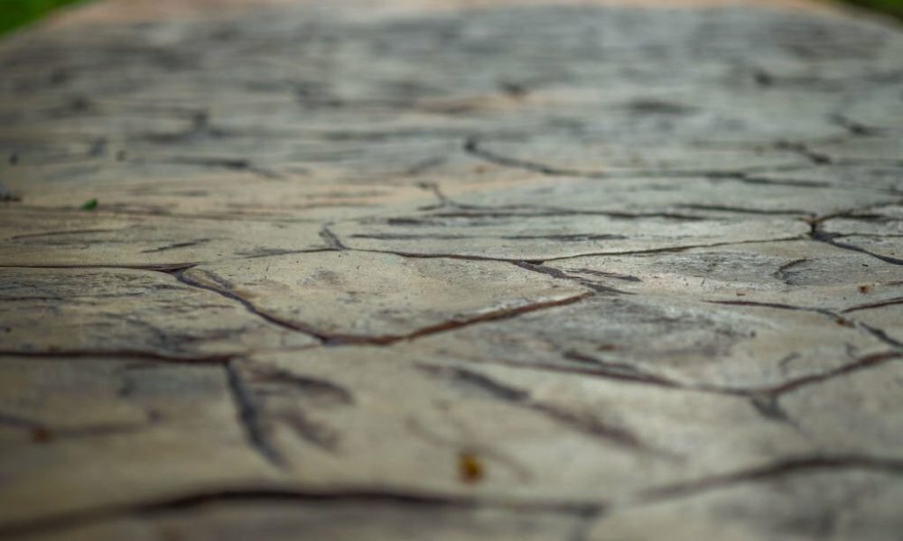 Close up view of walkway concrete stamped material, selective focus.